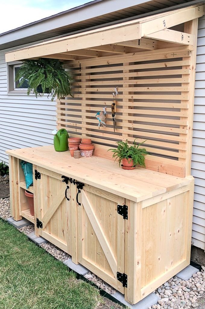 Potting bench with a hidden garbage can