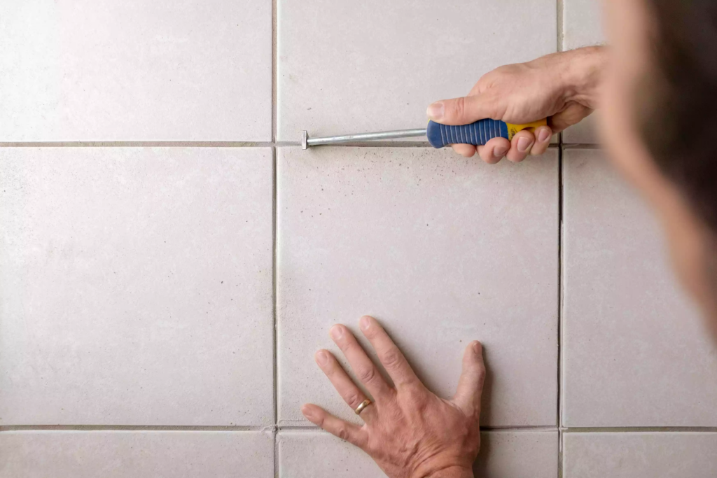 Remove the excess grout